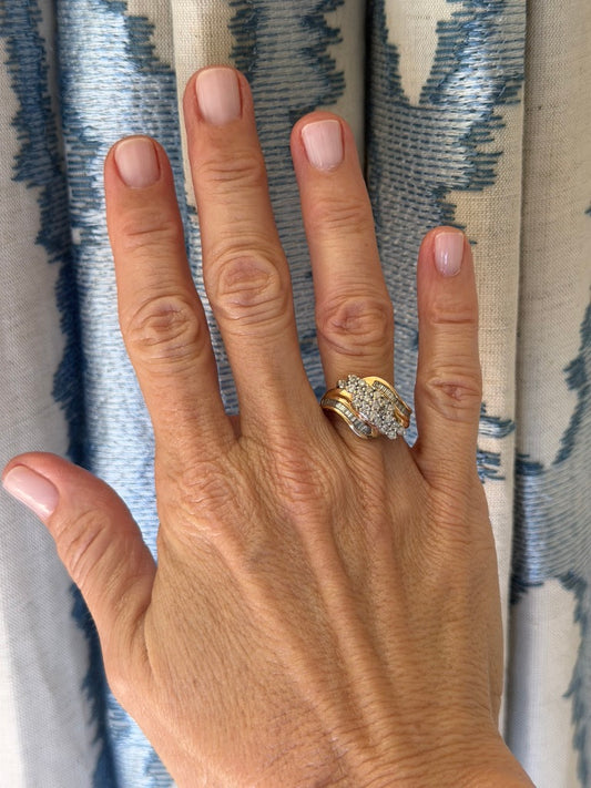 10k Round Diamond and Baguette Swirl Ring