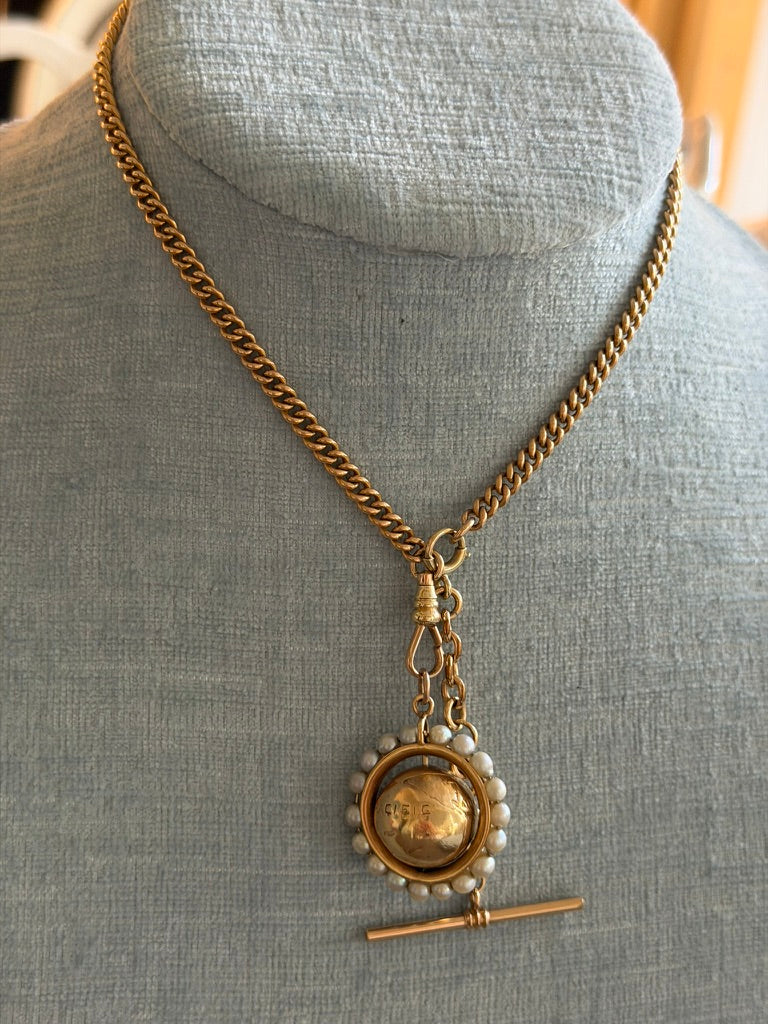 14k Articulated Globe Charm Surrounded by Seed Pearls